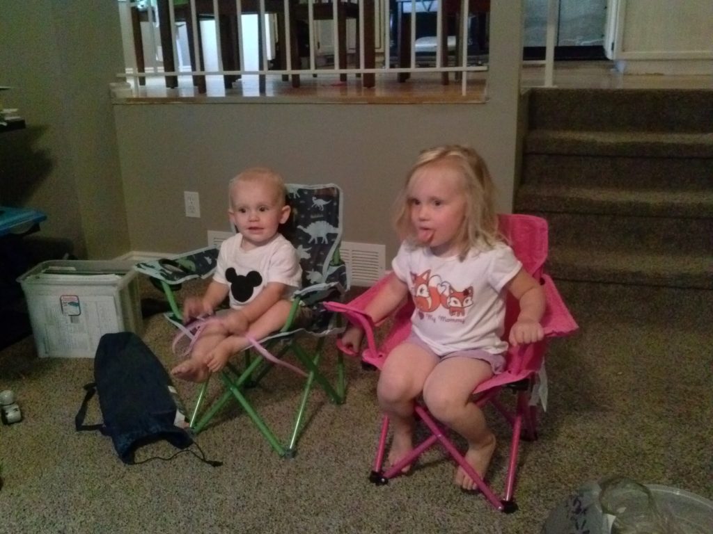 The kids in their matching camp chairs.