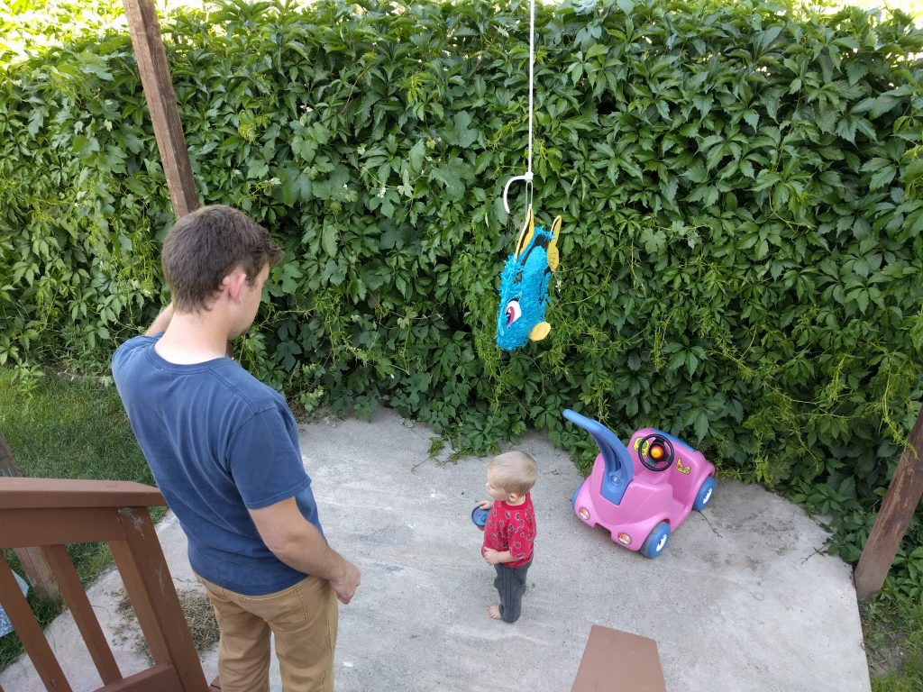 We all had a blast with the piñata! Nobody did much to it (not even me) until Josh's turn. Then he kind of decapitated it twice! It was great! 