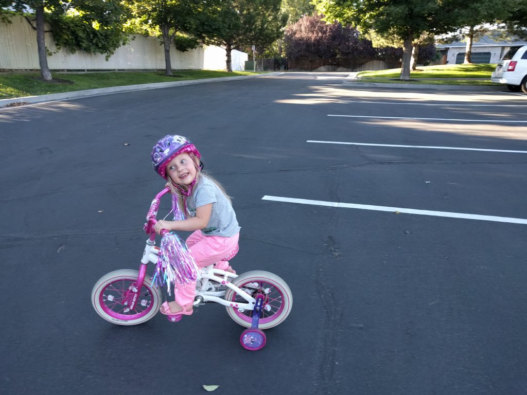 Fay is such a goofball! She loves making silly faces and silly noises. She also loves her pink and purple bike.