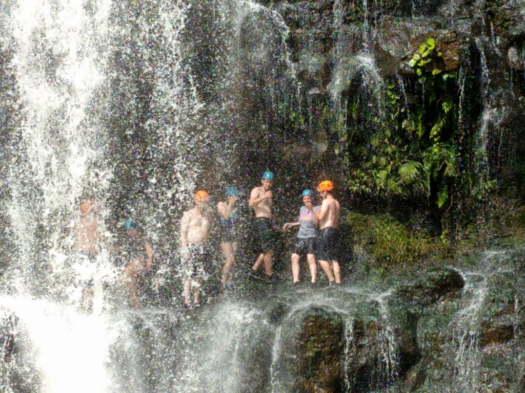 The family that hangs out in a waterfall together stays together!